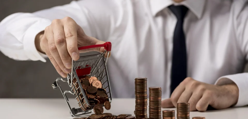 front-view-businessman-spilling-shopping-cart-coins